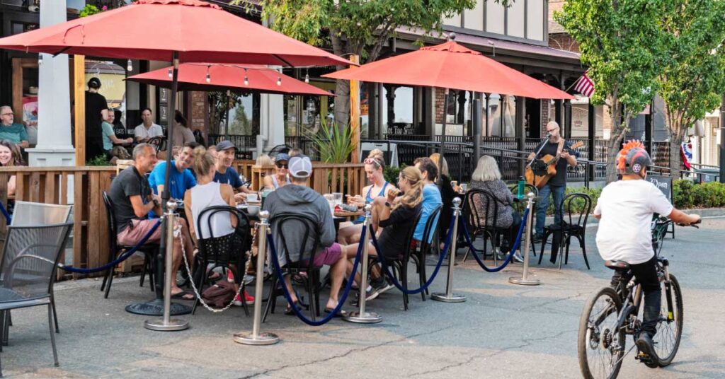 groups of people enjoying a meal on the outdoor patio on Sutter Street